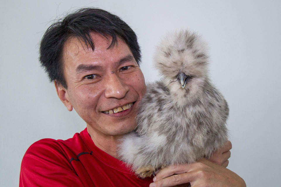 Eric Woo with his Silkie named Splash. (PHOTO: Dhany Osman / Yahoo News Singapore)