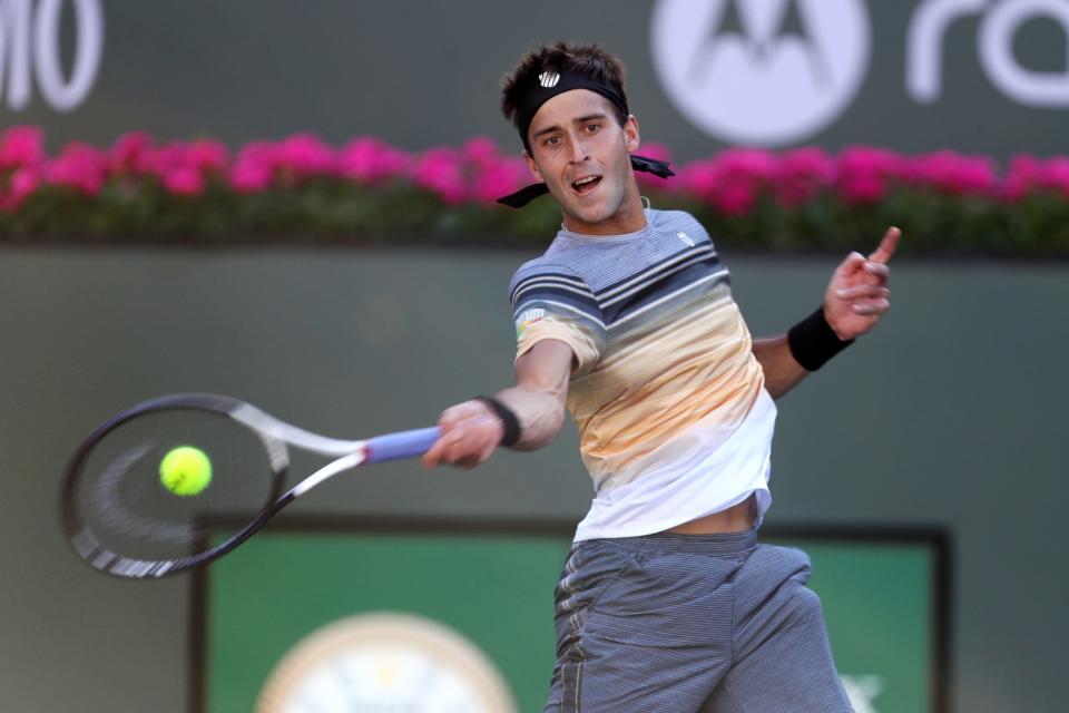 Tomas Martin Etcheverry returns to Andy Murray during the BNP Paribas Open at the Indian Wells Tennis Garden in Indian Wells, Calif., on March 9, 2023. 