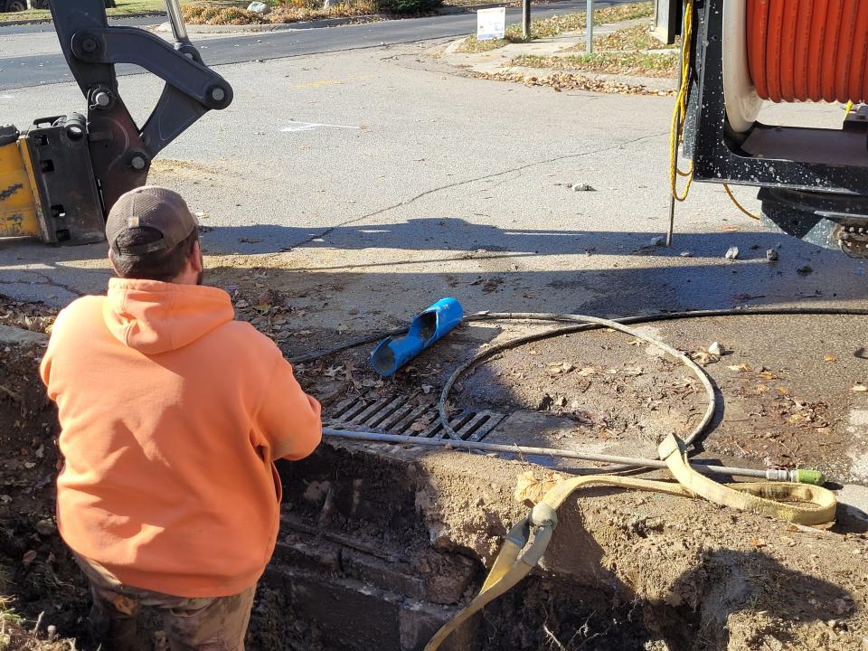 City of Bloomington workers repair a sewer pipe on Nov. 9, 2023, that was damaged by a fiber optic contractor this summer.