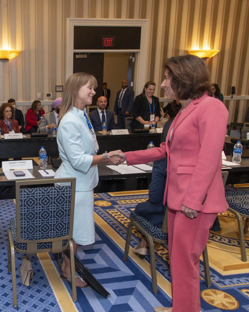 Florida's Great Northwest President and CEO Jennifer Conoley (left) shakes hands with U.S. Secretary of Commerce Gina Raimondo during the recent SelectUSA Investment Summit.