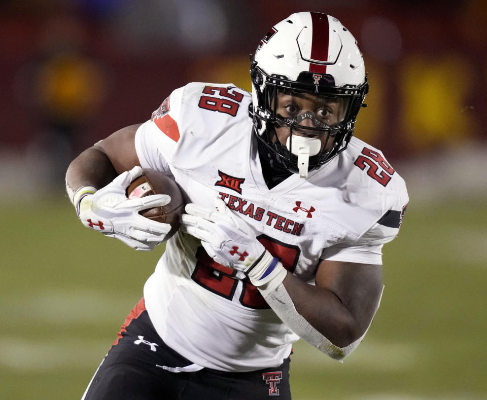 FILE - Texas Tech running back Tahj Brooks carries the ball upfield during the second half of an NCAA college football game against Iowa State, Nov. 19, 2022, in Ames, Iowa. Texas Tech opens their season at Wyoming on Sept. 2. (AP Photo/Charlie Neibergall, File)