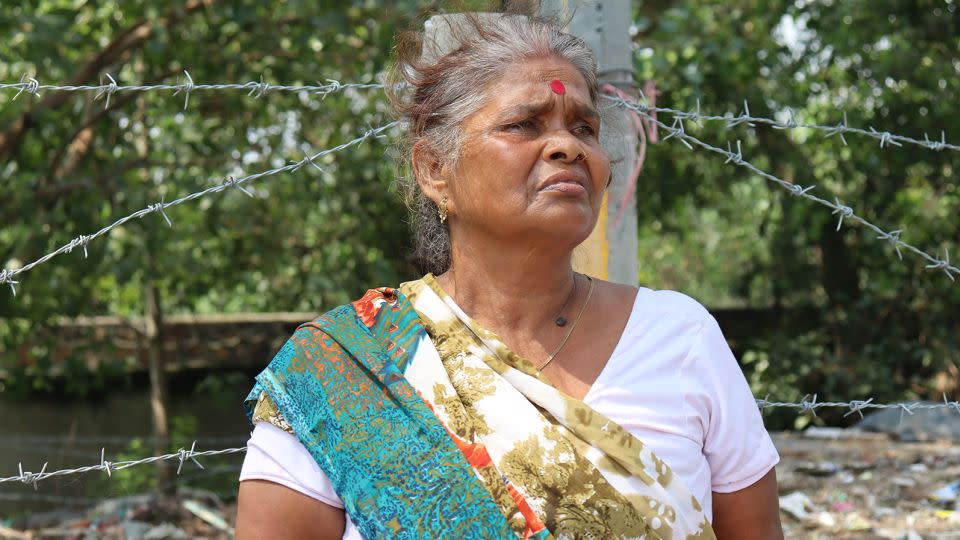 Jayanti Devi stands amid the rubble of what was her home of 30 years.  - Rhea Mogul/CNN