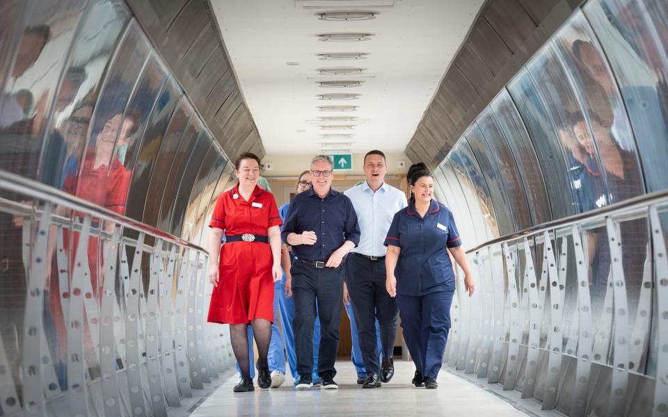 Labor leader Sir Keir Starmer and shadow health secretary Wes Streeting with staff at Bassetlaw Hospital in Nottinghamshire