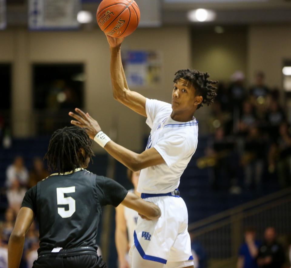 Washburn Rural's Amare Jones makes a pass against Topeka High on Wednesday, Jan. 10. Washburn Rural defeated Topeka High 89-65.