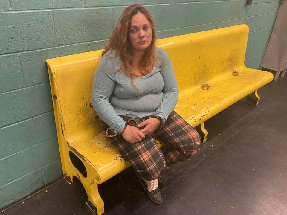 Woman sitting on yellow bench. (via Anderson Police Department)
