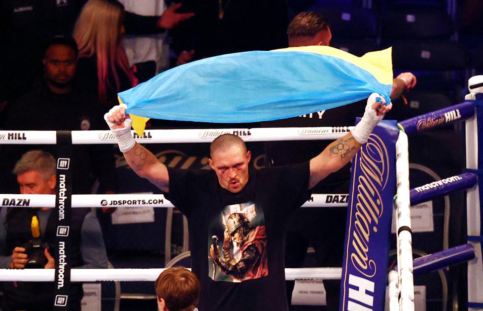 Ukrainian boxer Oleksandr Usyk (pictured) celebrates after defeating British heavyweight champion boxer Anthony Joshua.