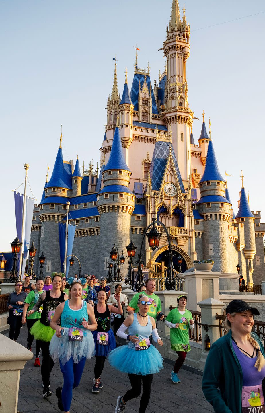 participants get to run through cinderella castle near dawn, an exclusive rundisney experience