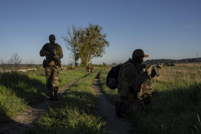 Ukrainian Border Guard soldiers participate in a military exercise in central Ukraine, Tuesday, May 2, 2023. Ahead of the much-anticipated Ukrainian counter-offensive, newly formed military assault units train in the country's dense forests. (AP Photo/Bernat Armangue)
