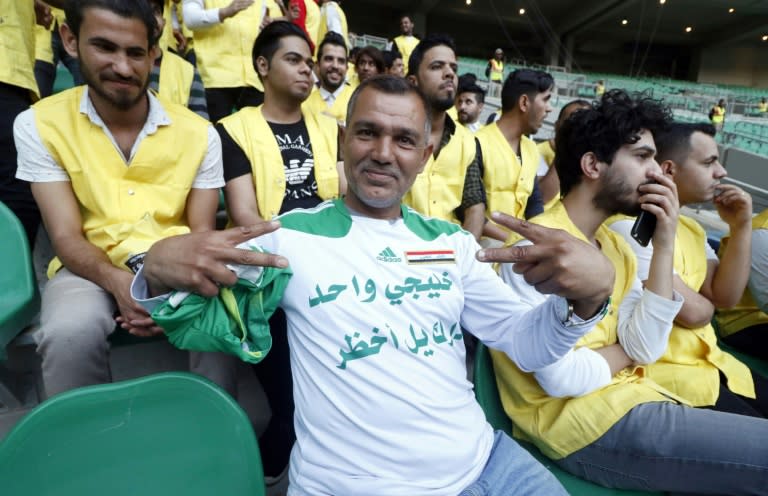 Iraqi supporters watch their team at a training session ahead of a home friendly against Saudi Arabia in Basra on February 28, 2018