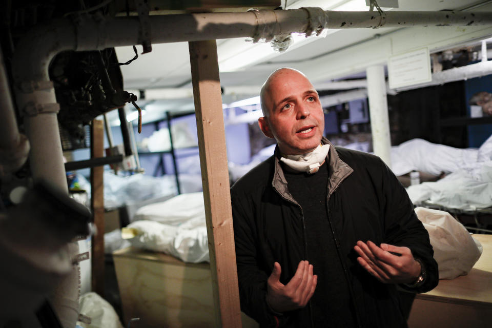 Pat Marmo, owner of Daniel J. Schaefer Funeral Home, is interviewed in his body holding facility Thursday, April 2, 2020, in the Brooklyn borough of New York. The company is equipped to handle 40-60 cases at a time. But amid the coronavirus pandemic, it was taking care of 185 Thursday morning. (AP Photo/John Minchillo)