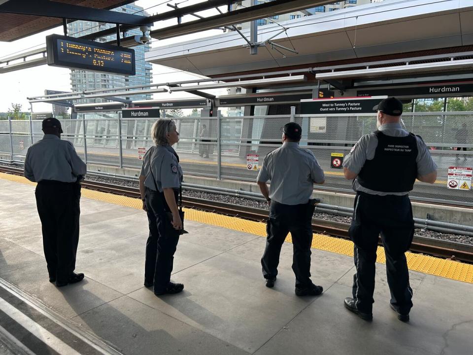 A group of OC Transpo fare inspectors at Hurdman Station in August 2024.