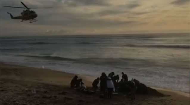 The dramatic scene that unfolded at falcon as friends and fellow surfers try desperately to save Ben Gerring. Photo: 7 News