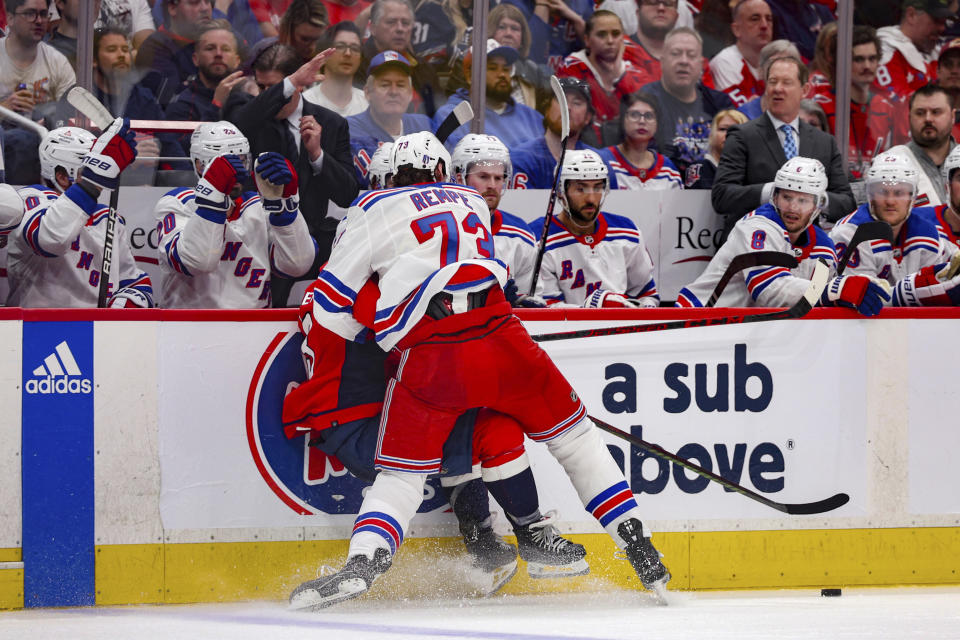 New York Rangers center Matt Rempe (73) checks Washington Capitals defenseman Nick Jensen during the second period in Game 4 of an NHL hockey Stanley Cup first-round playoff series Sunday, April 28, 2024, in Washington. (AP Photo/Tom Brenner)