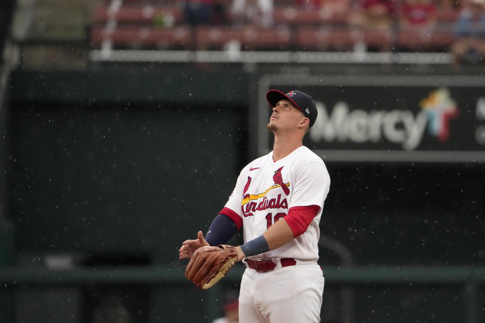 St. Louis Cardinals second baseman Nolan Gorman looks at the sky as a steady drizzle falls during the eighth inning of a baseball game against the Washington Nationals Sunday, July 16, 2023, in St. Louis. (AP Photo/Jeff Roberson)