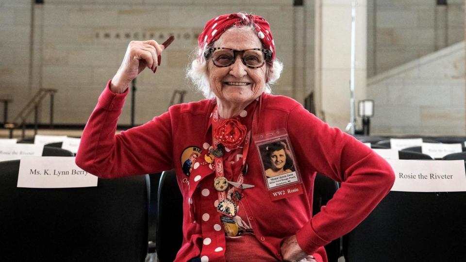 PHOTO: Sylvia 'Delsi' Tanis, 98 years old, an original member of the 'Rosies' poses for a portrait prior to a Congressional Gold Medal Ceremony in Emancipation Hall of the U.S. Capitol in Washington, U.S., April 10, 2024.  (Michael McCoy/Reuters)