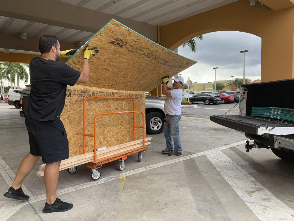 Shoppers load their truck with supplies to prepare ahead of Hurricane Dorian at The Home Depot on Thursday, Aug. 29, 2019, in Pembroke Pines, Fla. (AP Photo/Brynn Anderson)