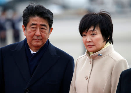 Japan's Prime Minister Shinzo Abe (L) and his wife Akie send off Emperor Akihito and Empress Michiko boarding a special flight for their visit to the Vietnam and Thailand, at Haneda Airport in Tokyo, Japan February 28, 2017. REUTERS/Issei Kato