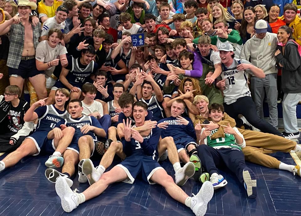 Manasquan players and fans celebrate Big Blue's 36-30 win over Rumson-Fair Haven in the NJSIAA Central Group 2 championship game in Manasquan on March 1, 2024.