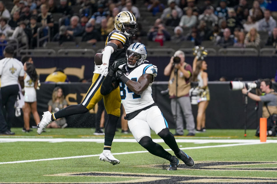 New Orleans Saints safety Jordan Howden breaks up a pass intended for Carolina Panthers tight end Stephen Sullivan during the second half of an NFL football game in New Orleans, Sunday, Dec. 10, 2023. (AP Photo/Gerald Herbert)