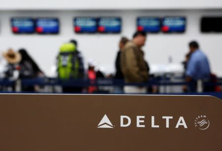 Passengers check in at a counter of Delta Air Lines in Mexico City, Mexico, August 8, 2016. REUTERS/Ginnette Riquelme/File Photo