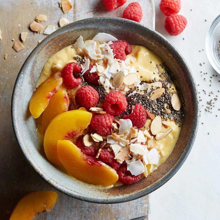 <p>This healthy smoothie recipe is a gateway to the smoothie-bowl craze. Use whatever fruit, nuts and seeds you like best to make it your own. Be sure to use frozen fruit in Step 1 to yield a creamy, frosty base for the toppings. <a href="https://www.eatingwell.com/recipe/254618/raspberry-peach-mango-smoothie-bowl/" rel="nofollow noopener" target="_blank" data-ylk="slk:View Recipe;elm:context_link;itc:0" class="link ">View Recipe</a></p>