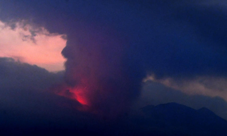 This long exposure image shows the eruption of volcano Sakurajima Sunday night, July 24, 2022, in the view from Tarumizu city, Japan's southern prefecture of Kagoshima. Japan’s Meteorological Agency said a volcano on Japan’s southern main island of Kyushu erupted Sunday night, spewing ash and volcanic rocks, but there were no immediate reports of damage or injuries in nearby towns. (Kyodo News via AP)