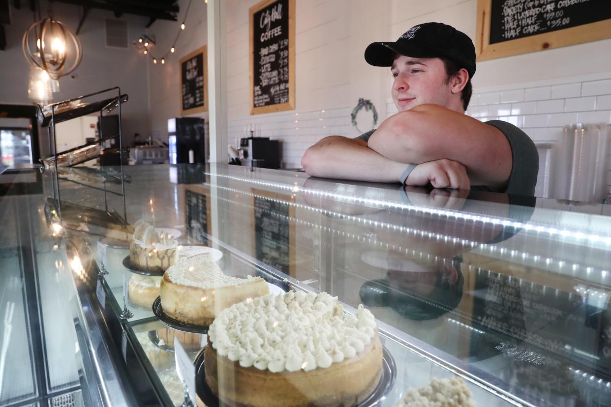 City Hall Cheesecake employee Dylan Brinkley inside the Silo Square development store in Southaven, Miss. on Tuesday, April 27, 2021. 