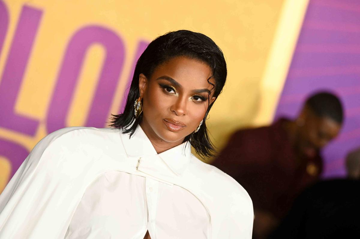 Ciara shows off her growing baby bump in white dress while taking