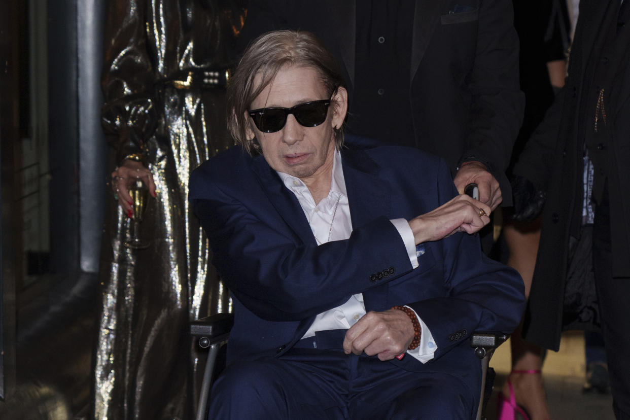 Shane MacGowan poses for photographers upon arrival at the Shane MacGowan, The Eternal Buzz & The Crock of Gold Exhibition in London, Tuesday, Oct. 11, 2022. (Photo by Scott Garfitt/Invision/AP)