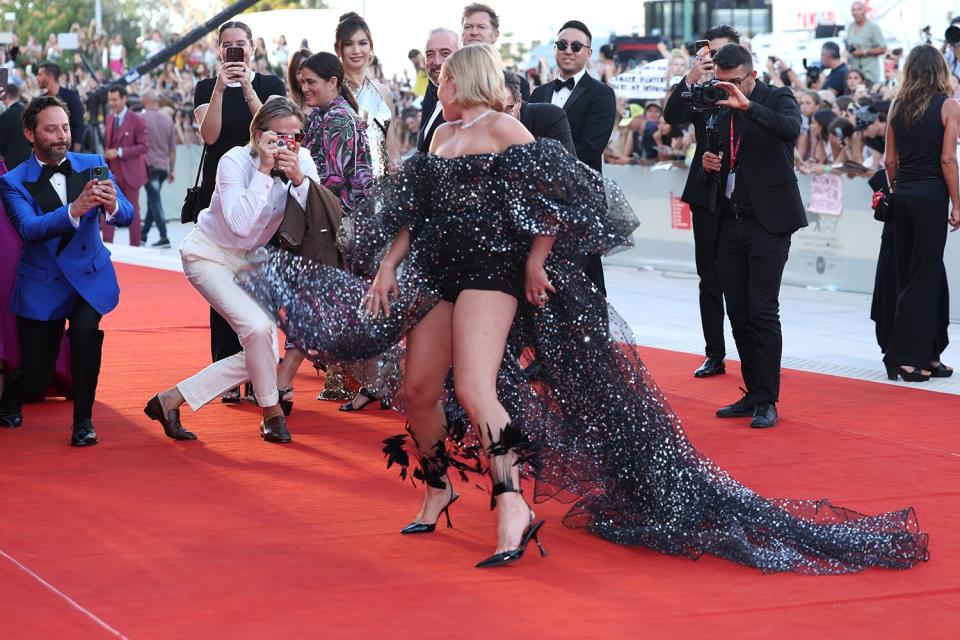 Chris Pine takes a picture of Florence Pugh on the "Don't Worry Darling" red carpet at the 79th Venice International Film Festival