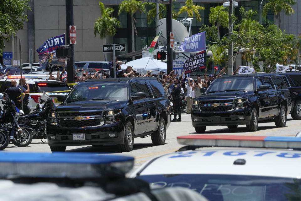 The motorcade carrying former President Donald Trump arrives at the Wilkie D. Ferguson Jr. U.S. Courthouse, Tuesday, June 13, 2023, in Miami. Trump is making a federal court appearance on dozens of felony charges accusing him of illegally hoarding classified documents and thwarting the Justice Department's efforts to get the records back. (AP Photo/Marta Lavandier)