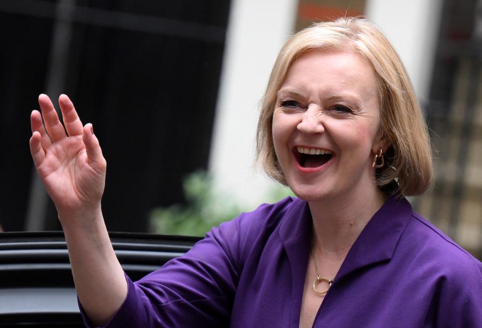 New Conservative Party leader and incoming prime minister Liz Truss smiles and waves as she arrives at Conservative Party Headquarters in central London having been announced the winner of the Conservative Party leadership contest at an event in central London on September 5, 2022. - Truss is the UK's third female prime minister following Theresa May and Margaret Thatcher. The 47-year-old has consistently enjoyed overwhelming support over 42-year-old Sunak in polling of the estimated 200,000 Tory members who were eligible to vote. (Photo by Daniel LEAL / AFP) (Photo by DANIEL LEAL/AFP via Getty Images)