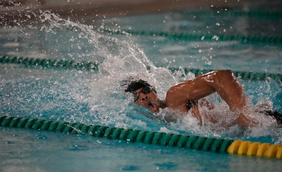 Tristan Jordan of Bishop Hendricken swims in a freestyle race at a meet on Monday.