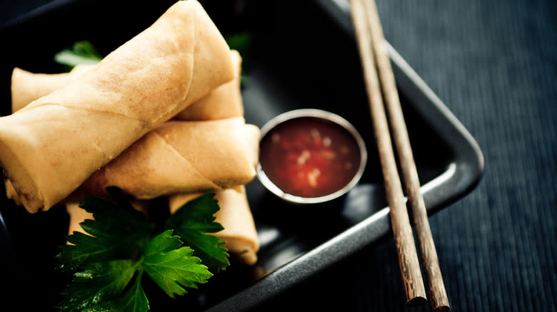 stack of spring rolls on plate