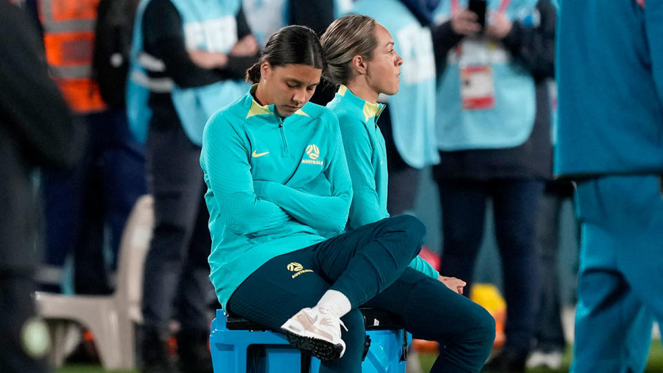 Pictured here, a dejected Sam Kerr sits on the sidelines during Australia's opening Women's World Cup game.