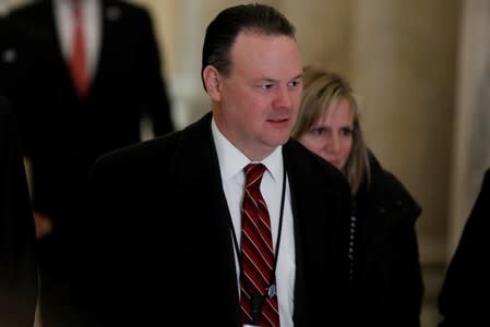 FILE PHOTO: Rick Dearborn, White House Deputy Chief of Staff for Legislative Affairs, departs following a Congressional Gold Medal ceremony for former Senator Bob Dole at the U.S. Capitol in Washington