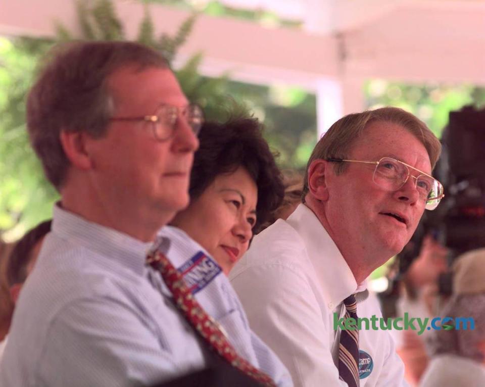 U.S. Sen. Mitch McConnell and his wife, Elaine Chao, and U.S. Rep. Jim Bunning, listened as Bunning’s opponent in the U.S. Senate Race, U.S. Rep. Scotty Baseler, attacked Bunning’s record in Congress during the 1998 Fancy Farm Picnic.
