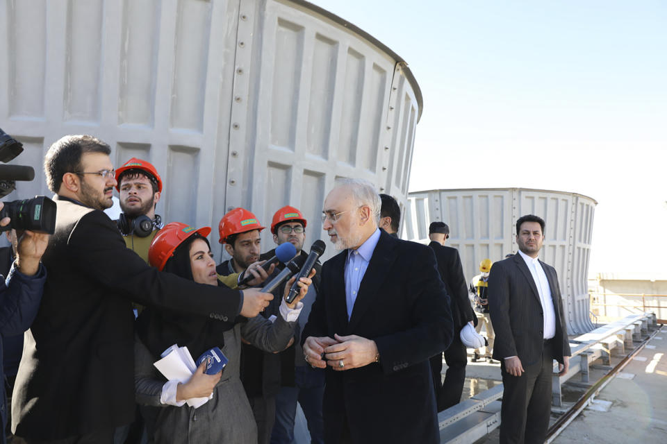 In this photo released by the Atomic Energy Organization of Iran, Ali Akbar Salehi, head of the organization, speaks with media at the Arak heavy water nuclear site, near the city of Arak, 150 miles (250 kilometers) southwest of the capital Tehran, Iran, Monday, Dec. 23, 2019. The head of Iran’s nuclear agency says his country has begun new operations at the heavy water nuclear reactor. The move intensifies pressure on Europe to find an effective way around U.S. sanctions, which block Tehran’s oil sales abroad. (Atomic Energy Organization of Iran via AP)