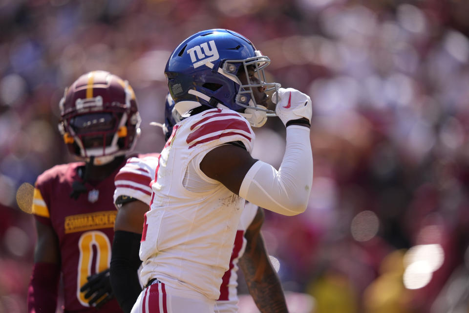 New York Giants wide receiver Malik Nabers, front celebrates his touchdown catch against the Washington Commanders during the first half of an NFL football game in Landover, Md., Sunday, Sept. 15, 2024. (AP Photo/Matt Slocum)