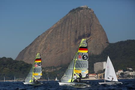 German Olympic team sailors Erik Heil and Thomas Ploessel (5) next to teammates during their training session in the 49er class in Rio de Janeiro, Brazil, July 12, 2016. Picture taken on July 12, 2016. REUTERS/Bruno Kelly