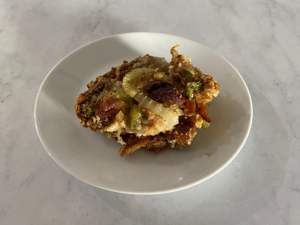 Sunny Anderson's stuffing on a white plate on a white counter