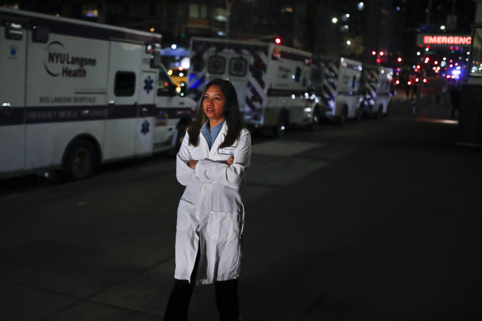 CORRECTS SPELLING TO DOOBAY INSTEAD OF DOOBEY ON SECOND REFERENCE - Kamini Doobay, an Emergency Medicine Resident physician at NYU Langone Medical Center and Bellevue Hospital, talks during an interview about her experiences treating COVID-19 patients, Thursday, March 26, 2020, in New York. As an emergency medicine physician in New York City, Dr. Doobay has always known that death is part of the territory in trying to care for the city's sickest. But it hasn't been like this _ patients stricken with coronavirus, on ventilators, and no visitors allowed because of strict protocols to prevent its spread. (AP Photo/John Minchillo)