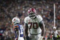 Alabama offensive lineman Javion Cohen (70) celebrates scoring to tie the game at 10-10 during the second half of an NCAA college football game, Saturday, Nov. 27, 2021, in Auburn, Ala. (AP Photo/Vasha Hunt)