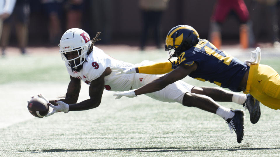 Rutgers wide receiver JaQuae Jackson (9) pulls in a reception as Michigan defensive back Josh Wallace (12) defends in the second half of an NCAA college football game in Ann Arbor, Mich., Saturday, Sept. 23, 2023. (AP Photo/Paul Sancya)