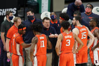 Illinois head coach Brad Underwood talks to his team during a timeout in the second half of an NCAA college basketball game against Michigan State, Tuesday, Feb. 23, 2021, in East Lansing, Mich. (AP Photo/Carlos Osorio)