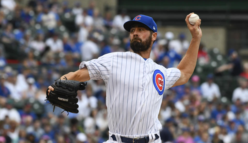 Cole Hamels leaves start against Reds with left oblique injury. (AP Photo/Matt Marton)