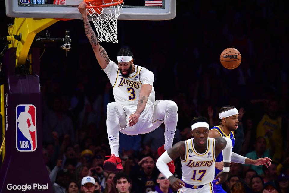 Lakers forward Anthony Davis dunks against the Warriors during the second half of Game 3 of their 2023 Western Conference semifinal matchup at Crypto.com Arena in Los Angeles.