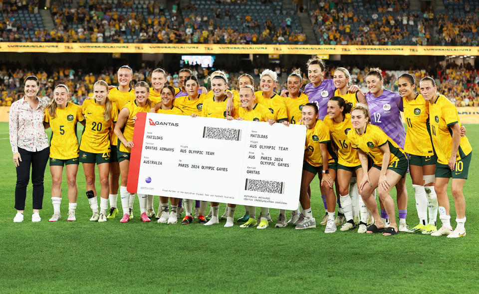 Matildas players, pictured here with Anna Meares and their ticket to Paris.