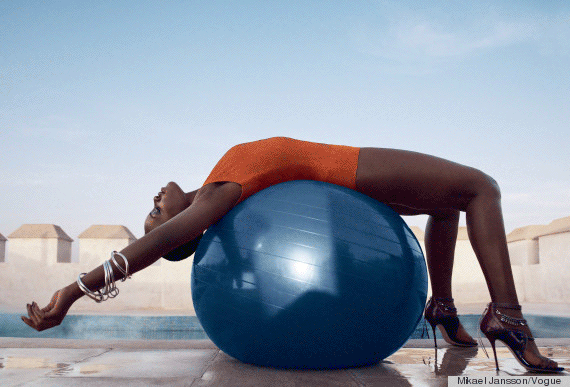 Lupita Nyong’o finding wellness on an exercise ball in the January <em>Vogue</em>.