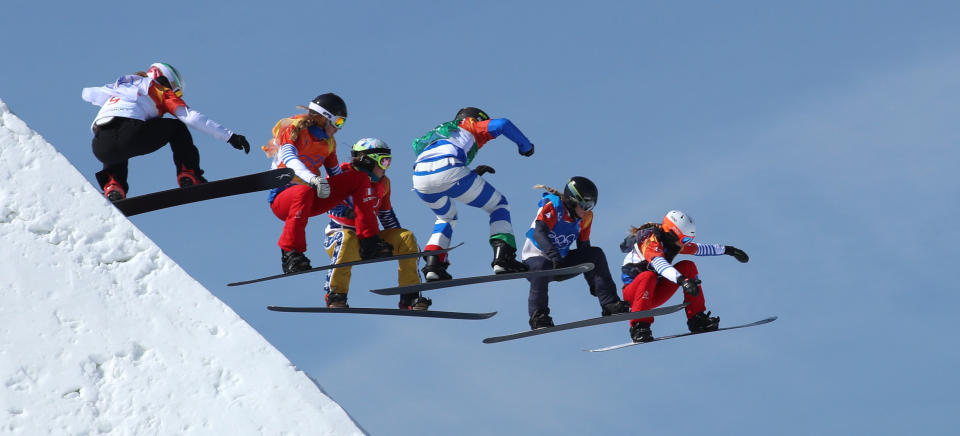 The snowboard cross final goes airborne at the Winter Olympics on Friday. (Photo: Mike Blake / Reuters)